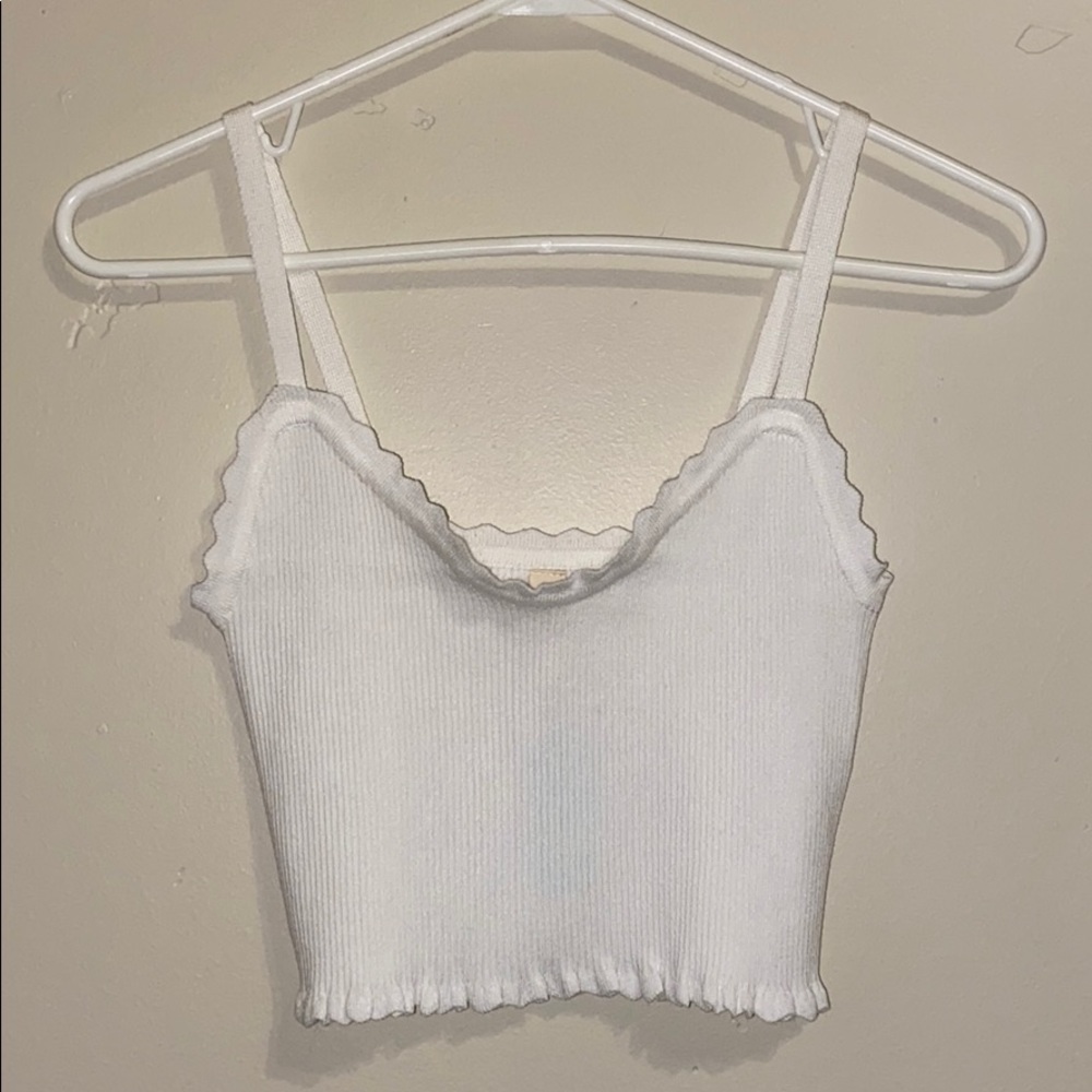 Very stretchy white tank top. NEW WITH TAGS!